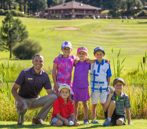 golfers with golf instructor