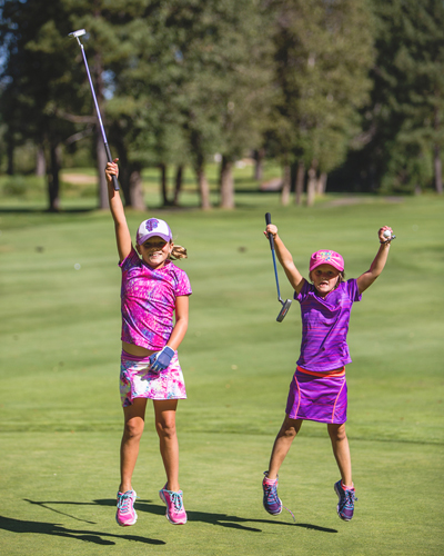 Golfers celebrating on golf course